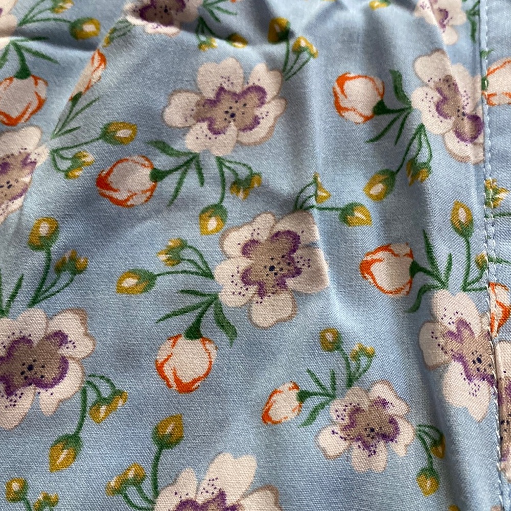 The size is a 1X all buttons are there intact no tears